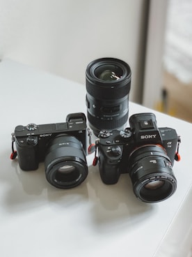 black nikon dslr camera on white table
