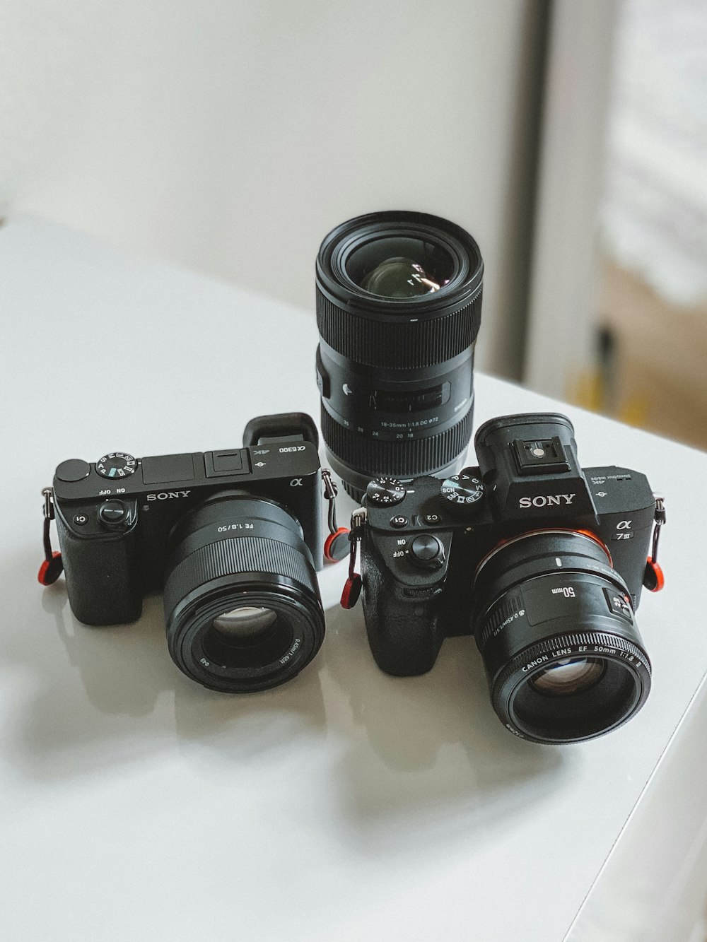 black nikon dslr camera on white table