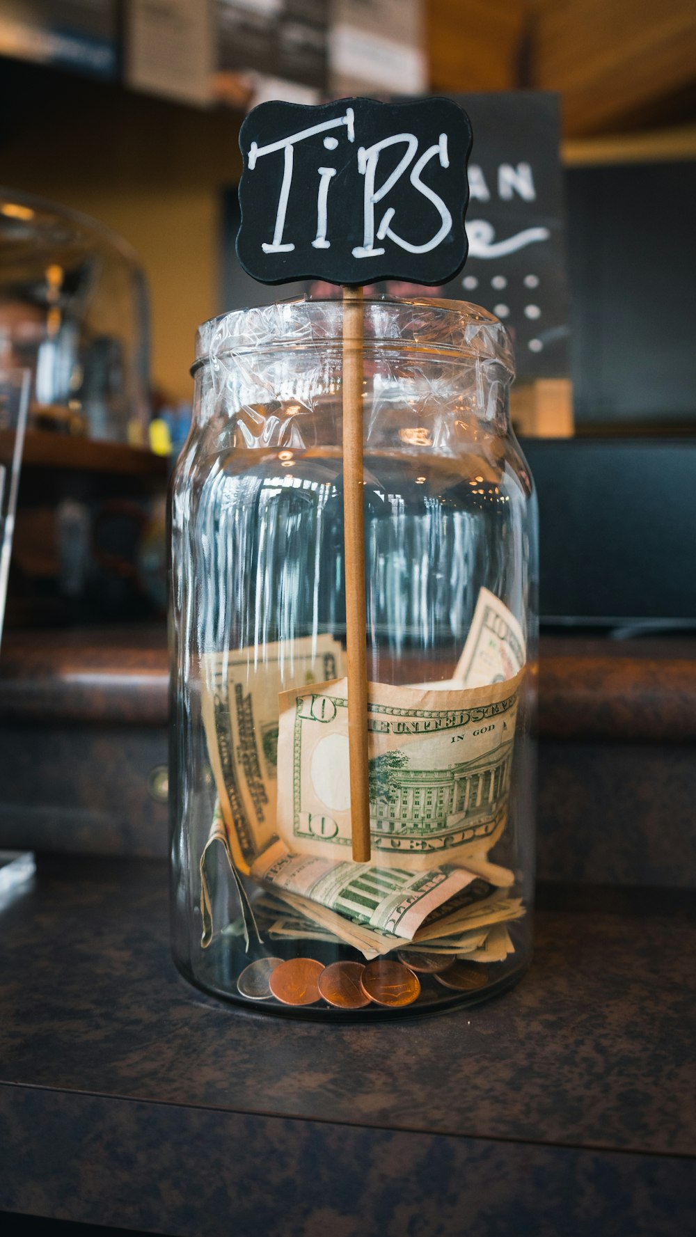 clear glass jar on brown wooden table