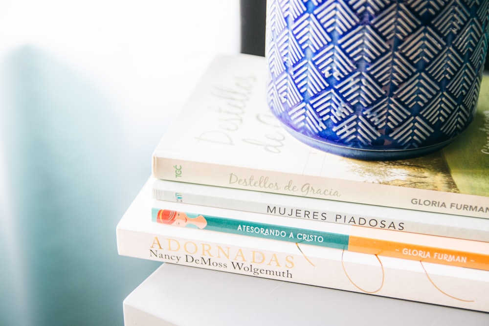 white and blue book on white table