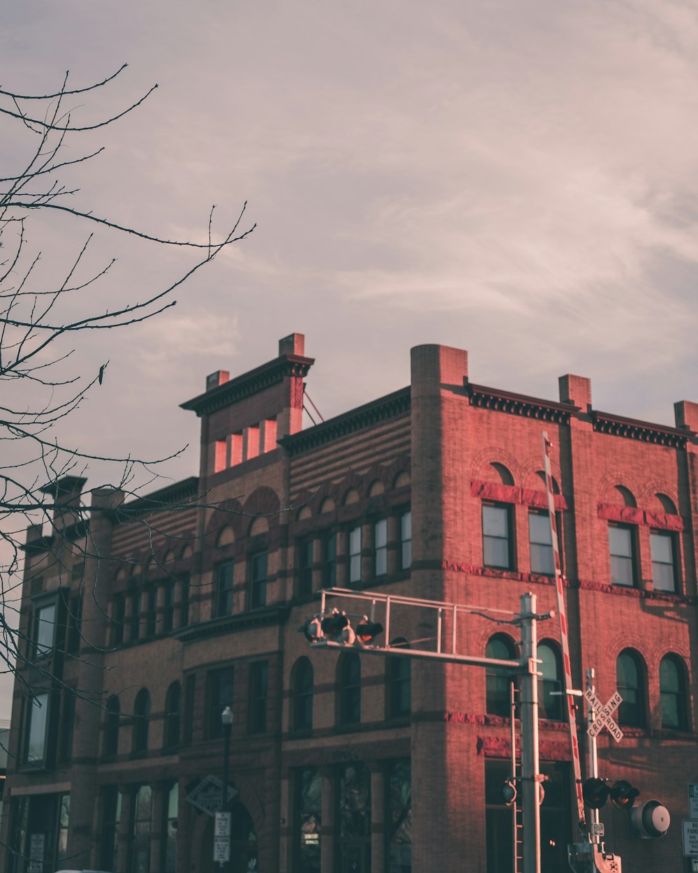 brown concrete building under cloudy sky during daytime