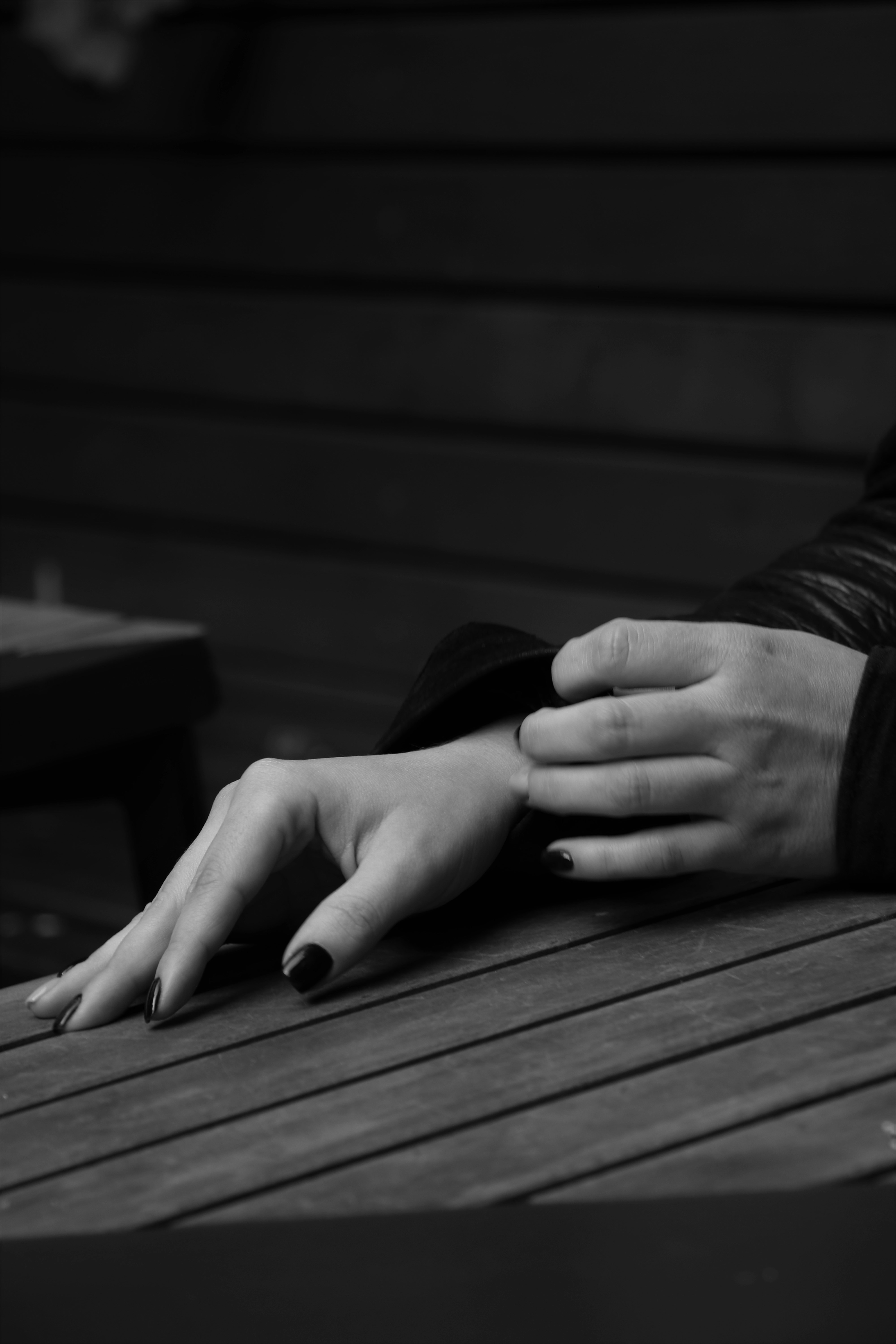 grayscale photo of person in long sleeve shirt