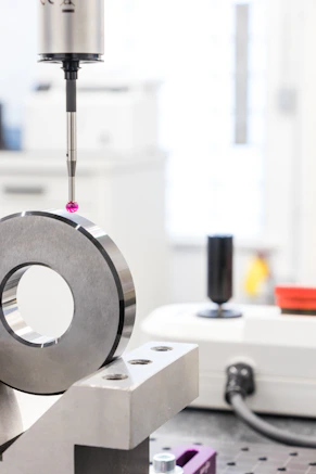 silver and black round portable speaker