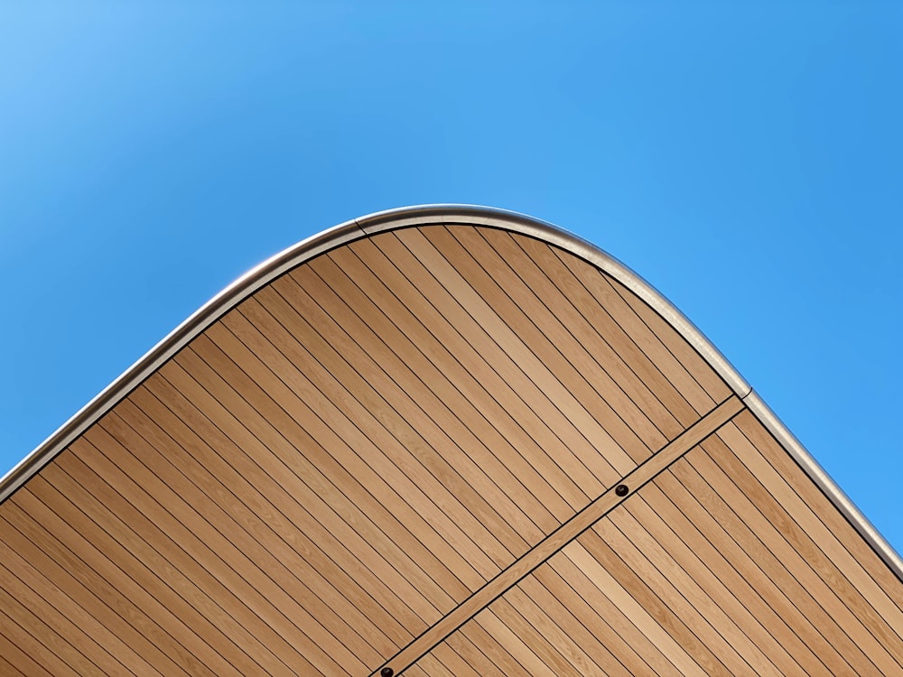 brown wooden wall under blue sky during daytime