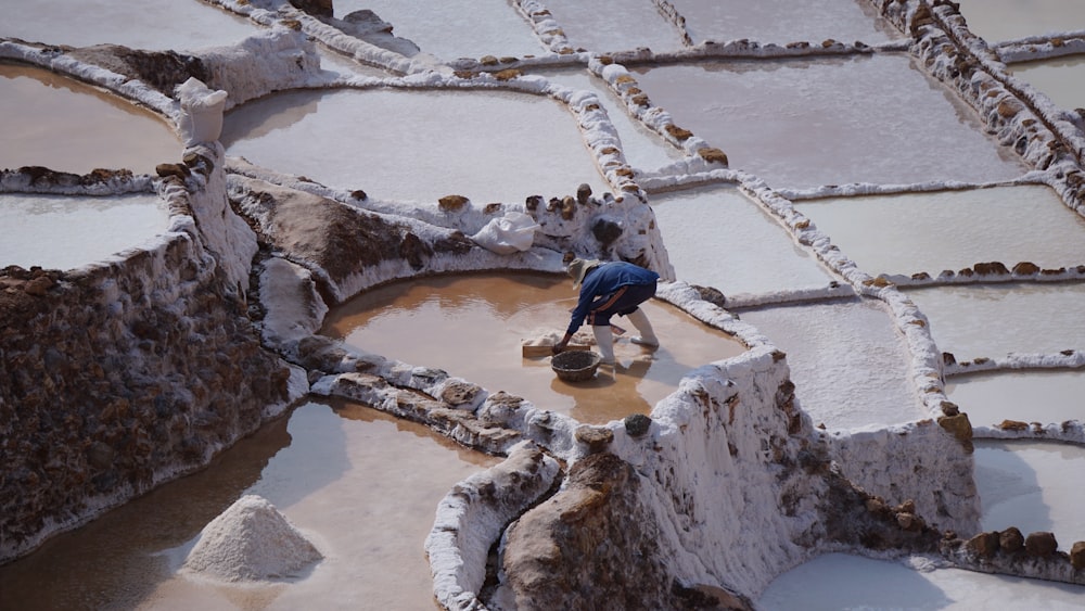 a man standing on top of a snow covered ground