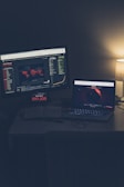 black flat screen computer monitor on white desk