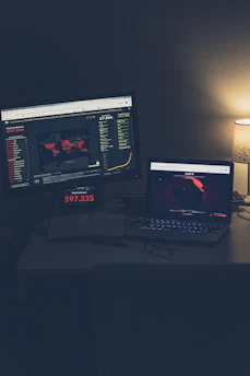 An executive war room illuminated by multiple large screens showing geopolitical risk maps and data streams.