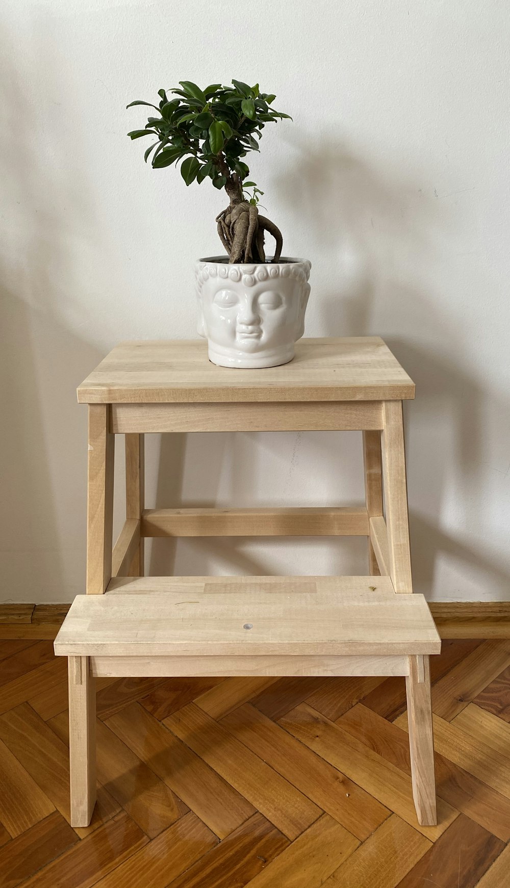 white ceramic mug on brown wooden table