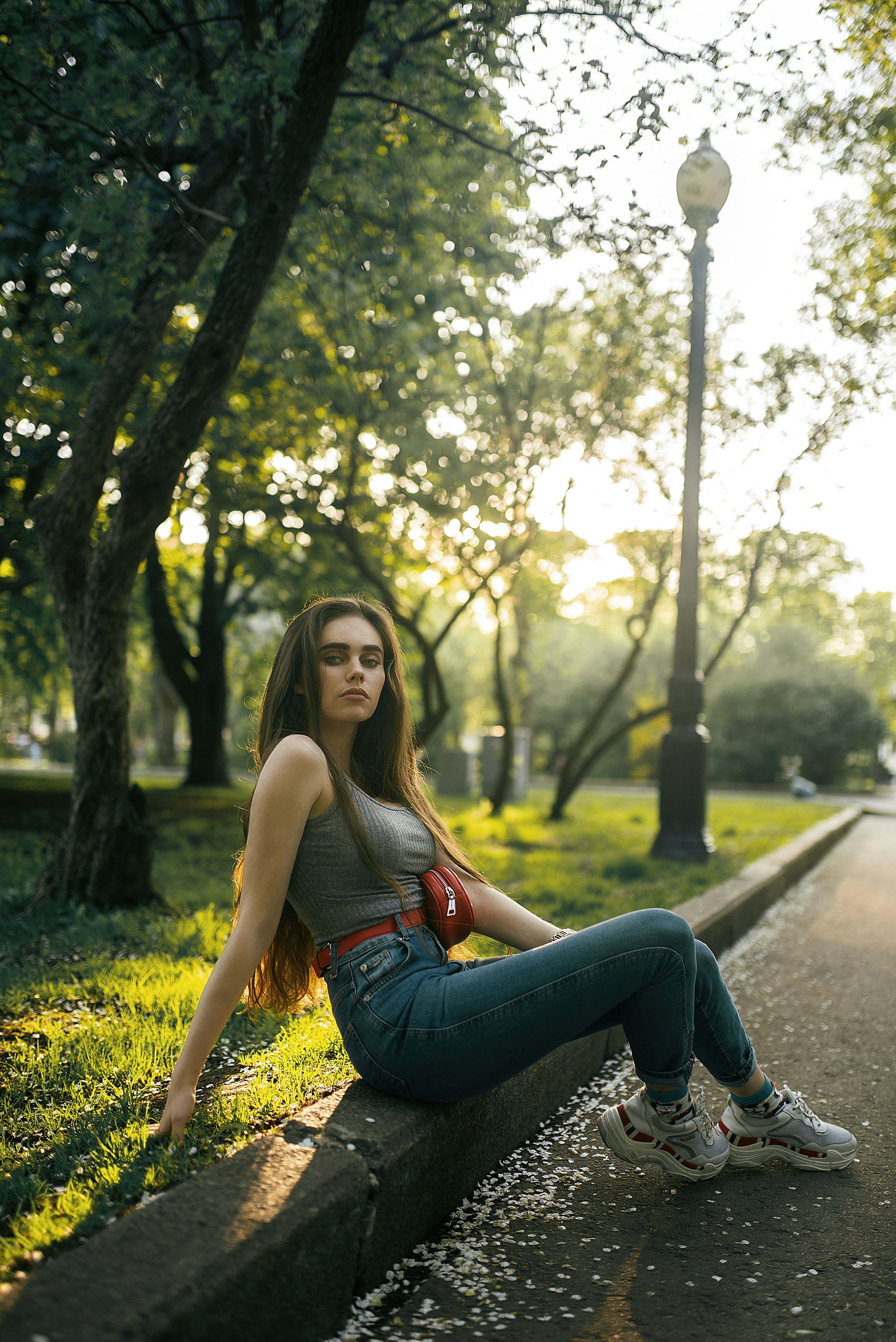 great photo recipe,how to photograph екатерина; woman in blue denim jeans sitting on concrete pathway during daytime