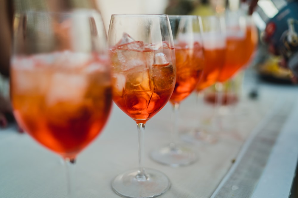 clear wine glass with brown liquid