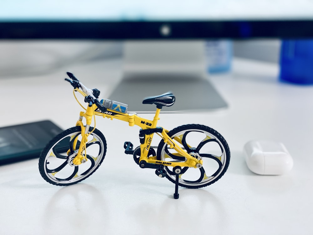 yellow and black bicycle scale model