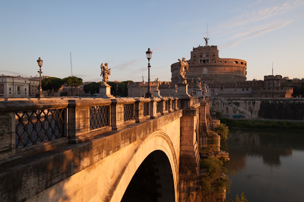 brown concrete bridge over river during daytime