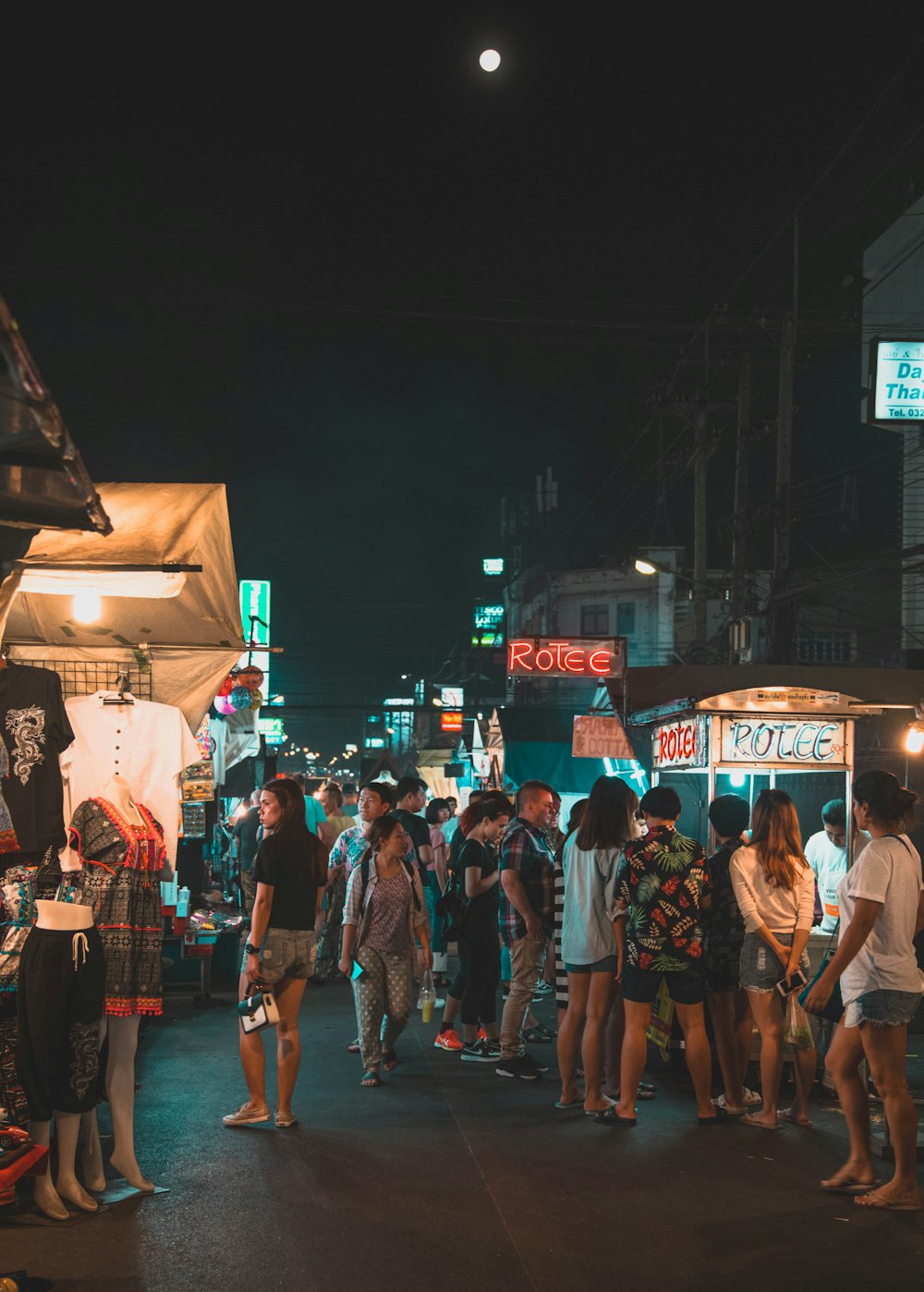 people walking on street during night time