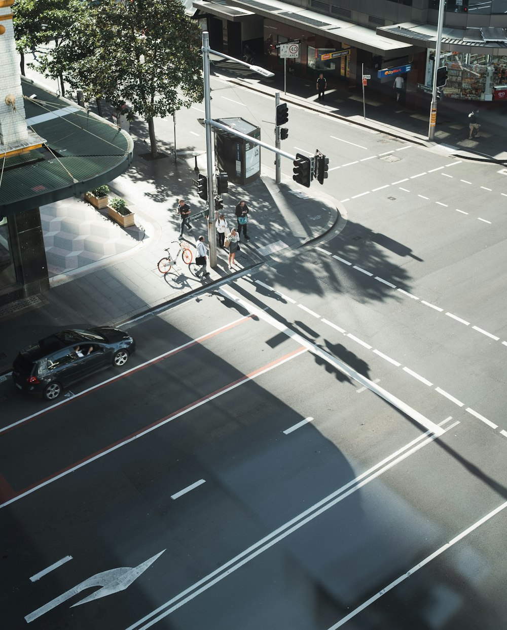 black sedan on road during daytime