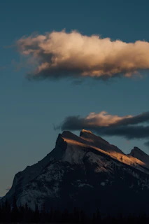 A serene mountain landscape under soft evening light.