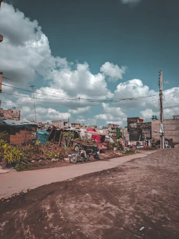 green and red truck on road during daytime