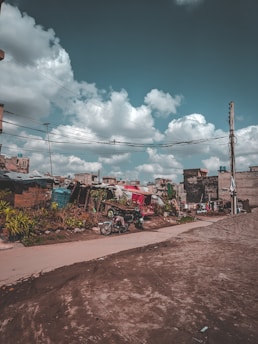 green and red truck on road during daytime