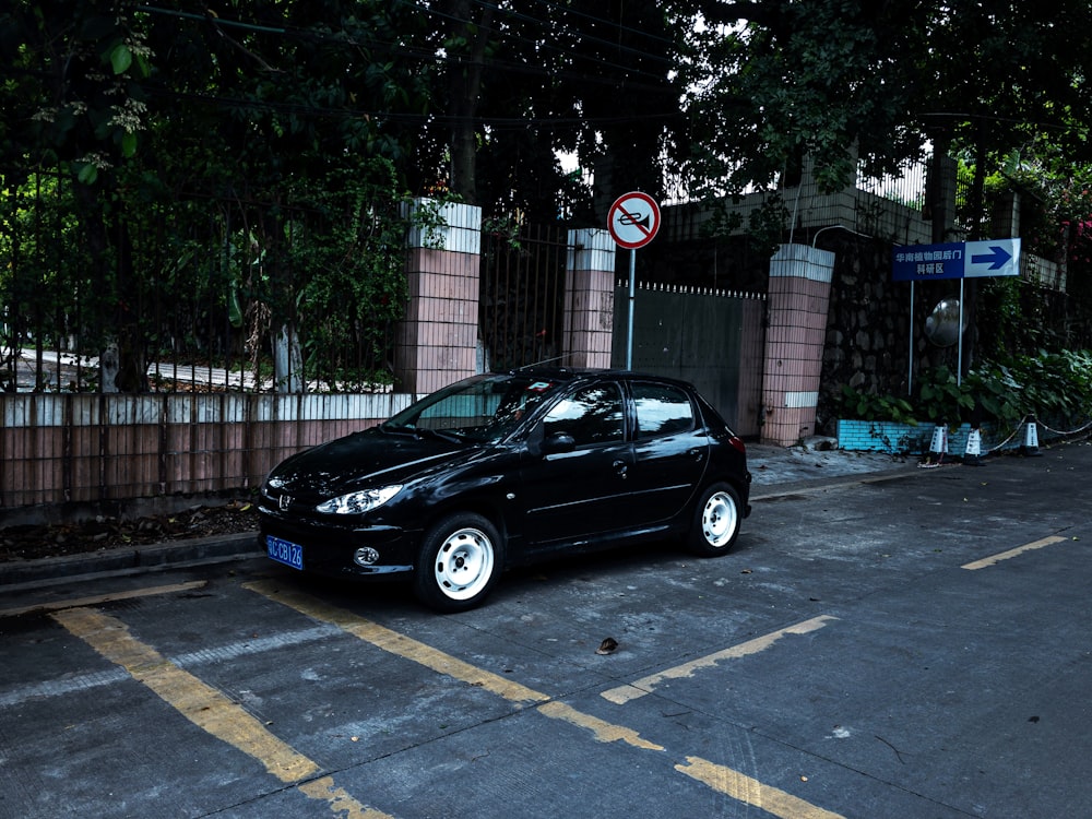 black sedan on road during daytime