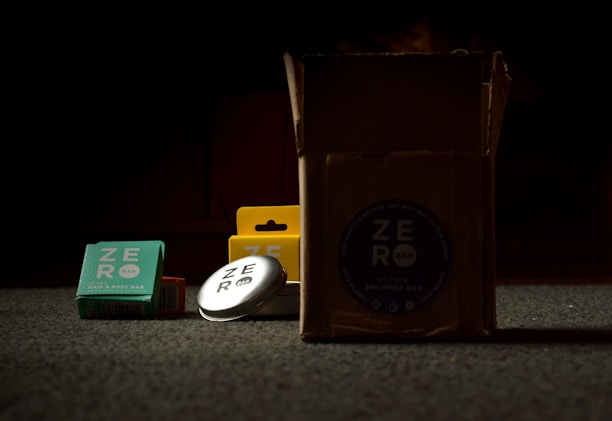 Smiling customer unpacking a box of Khatu Shyam Traders organic soap products at home.