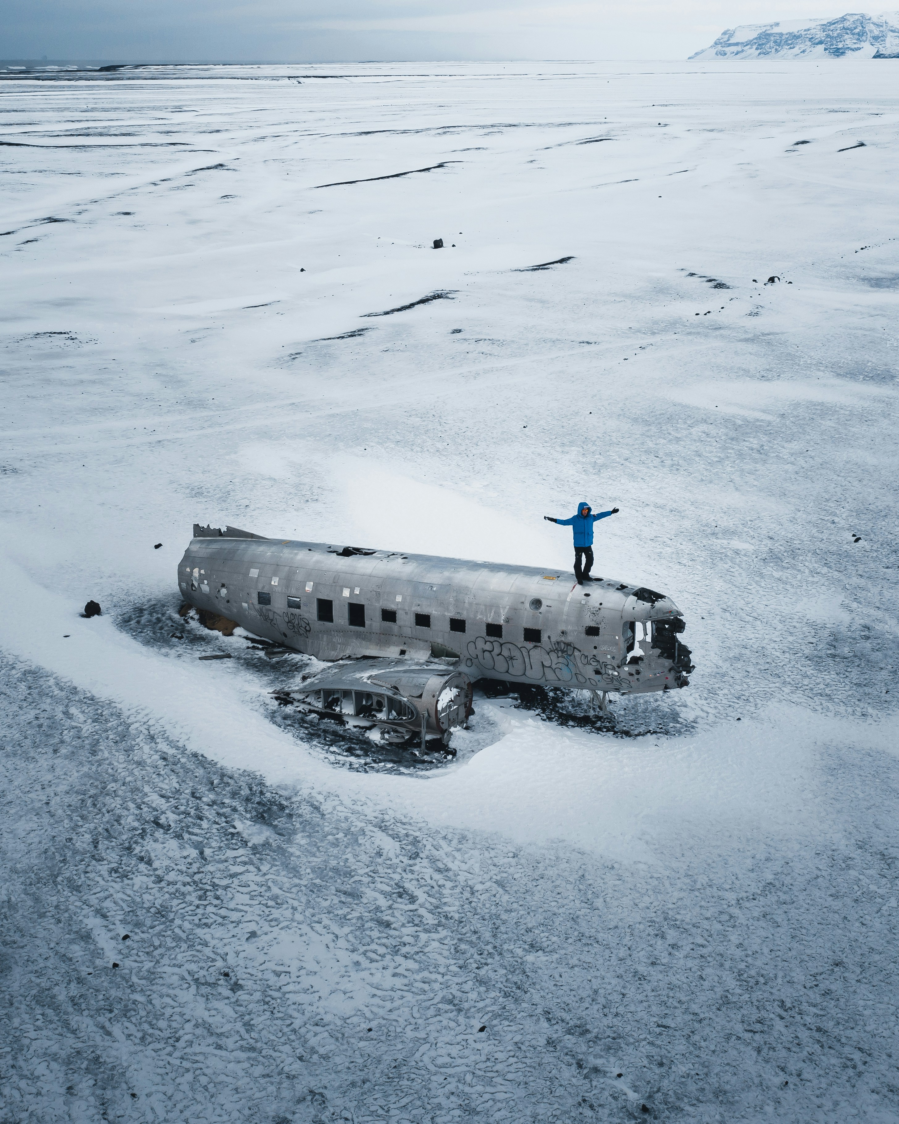 black and white ship on snow covered ground during daytime