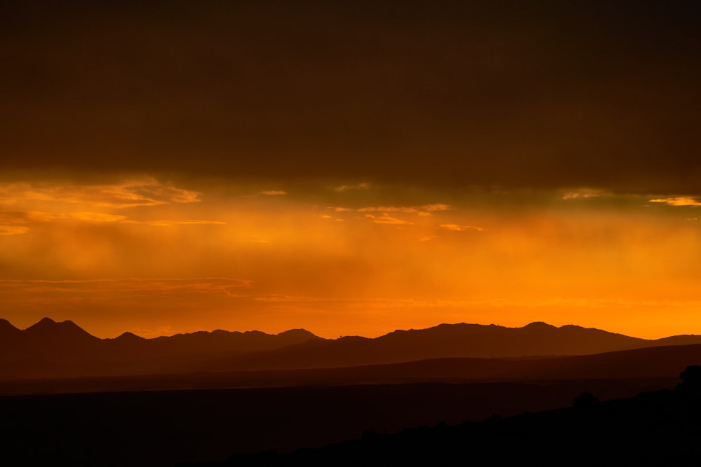 silhouette of mountain during sunset