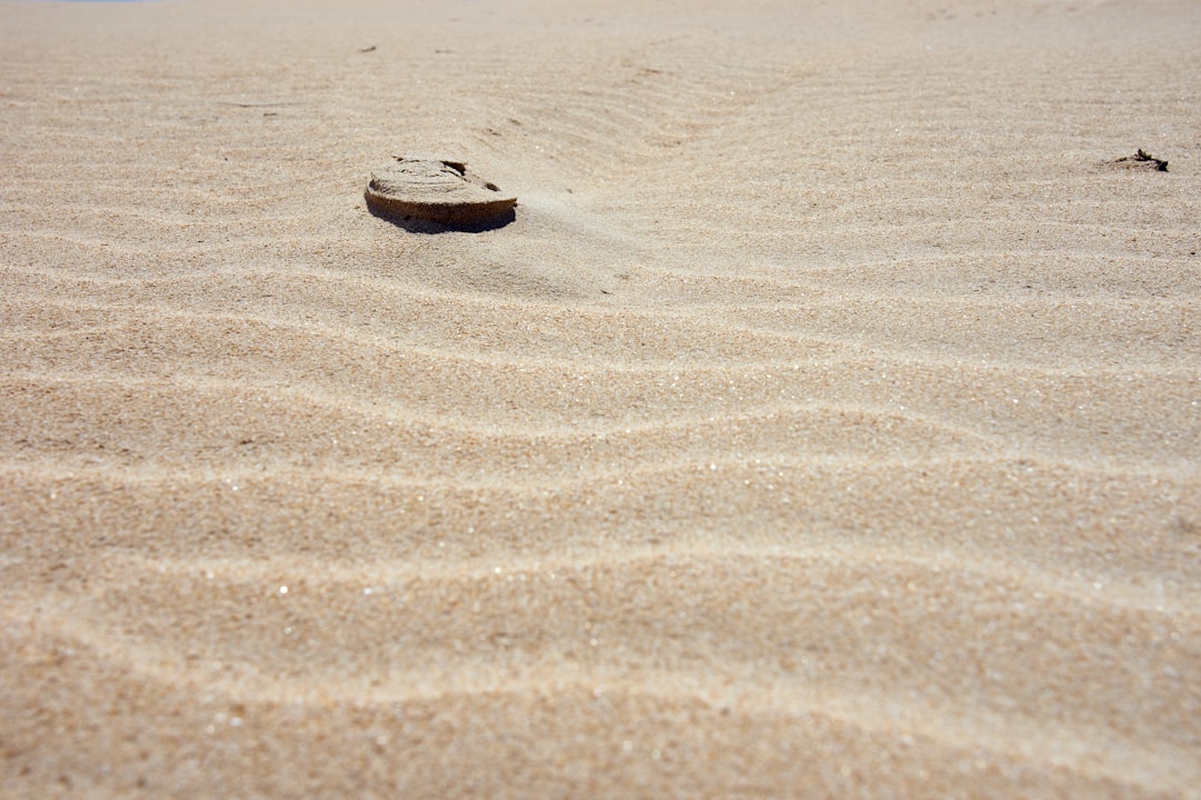 brown sand with heart shaped on the sand