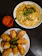 A happy customer enjoying a beautifully plated Asian fusion dish at Golden Ginger.