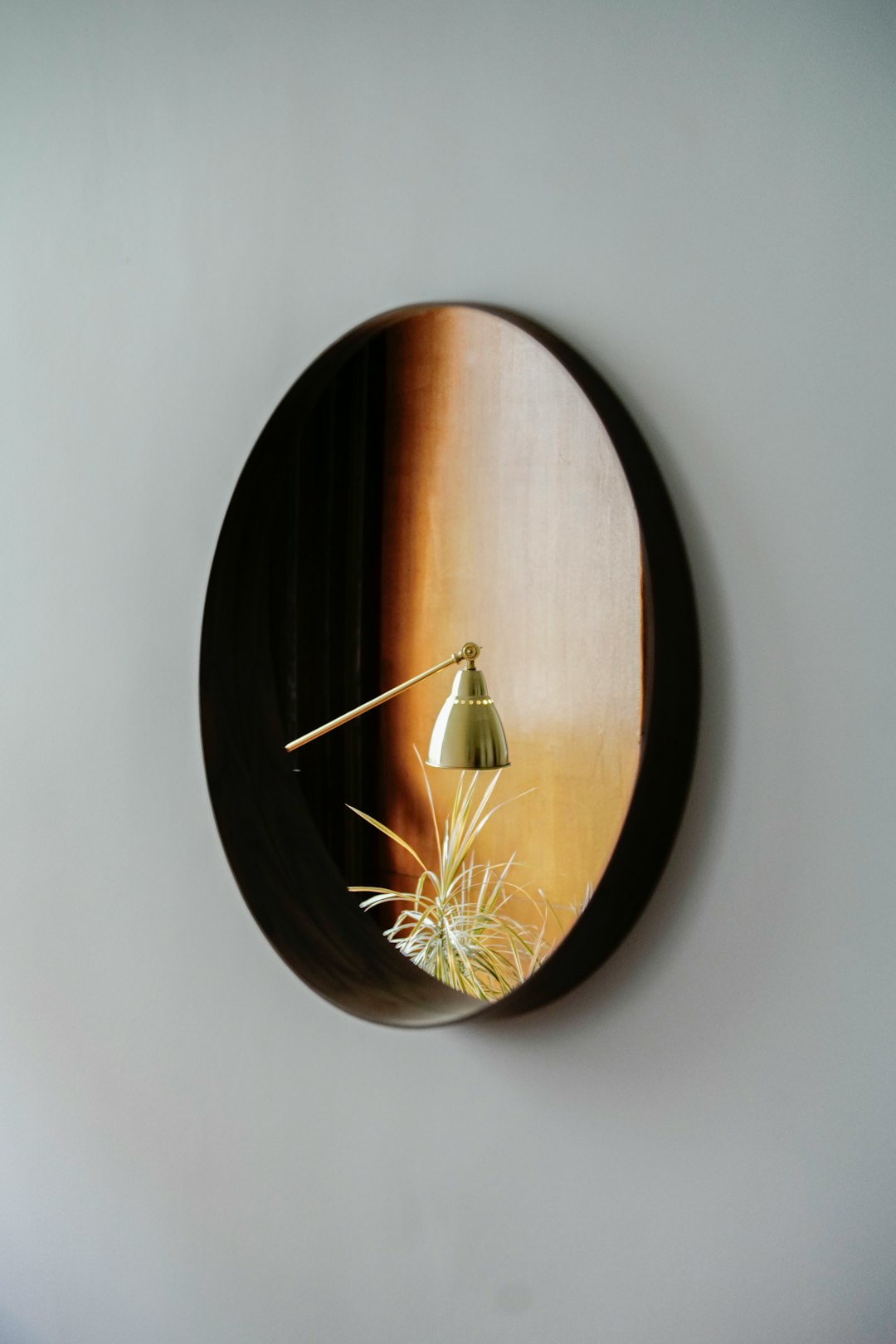 brown wooden round wall clock