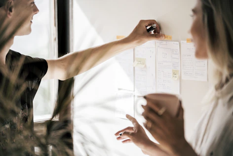 person holding white printer paper