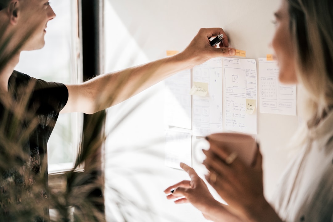 person holding white printer paper