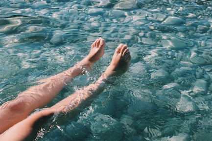 persons feet on water