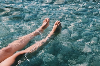 persons feet on water