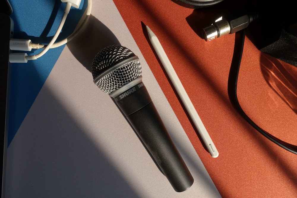 black and silver microphone on white table