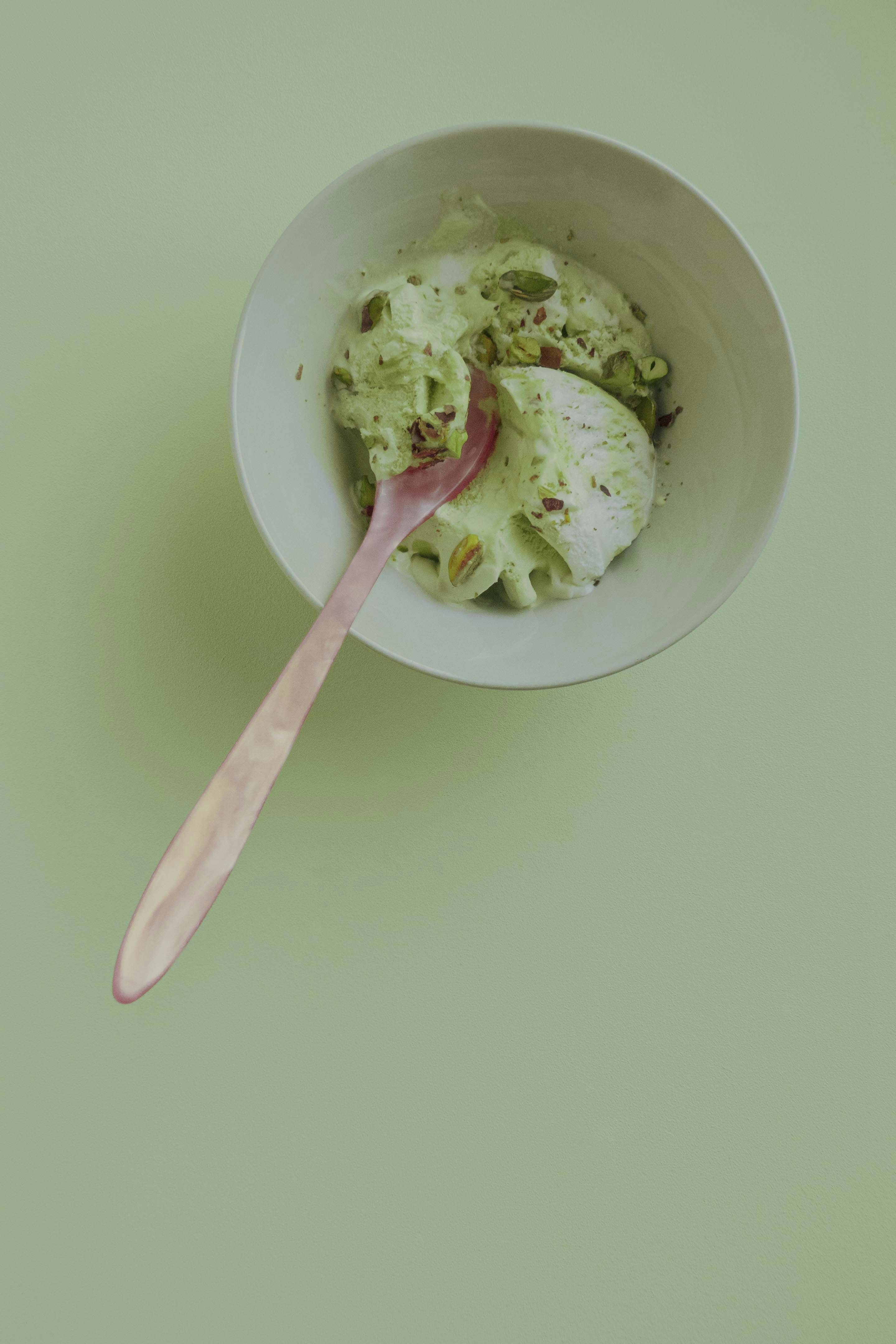 white ceramic bowl with pink spoon