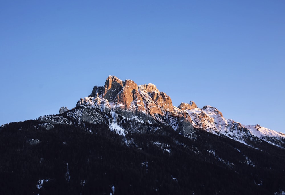 brown rocky mountain under blue sky during daytime