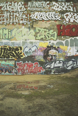 A wall covered in colorful graffiti that inspired Nijgman's early creative roots.