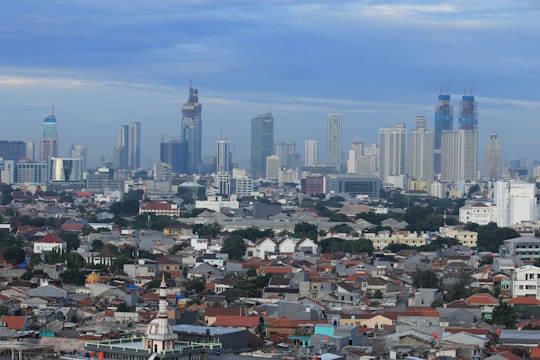 city skyline under blue sky during daytime in DKI Jakarta Indonesia