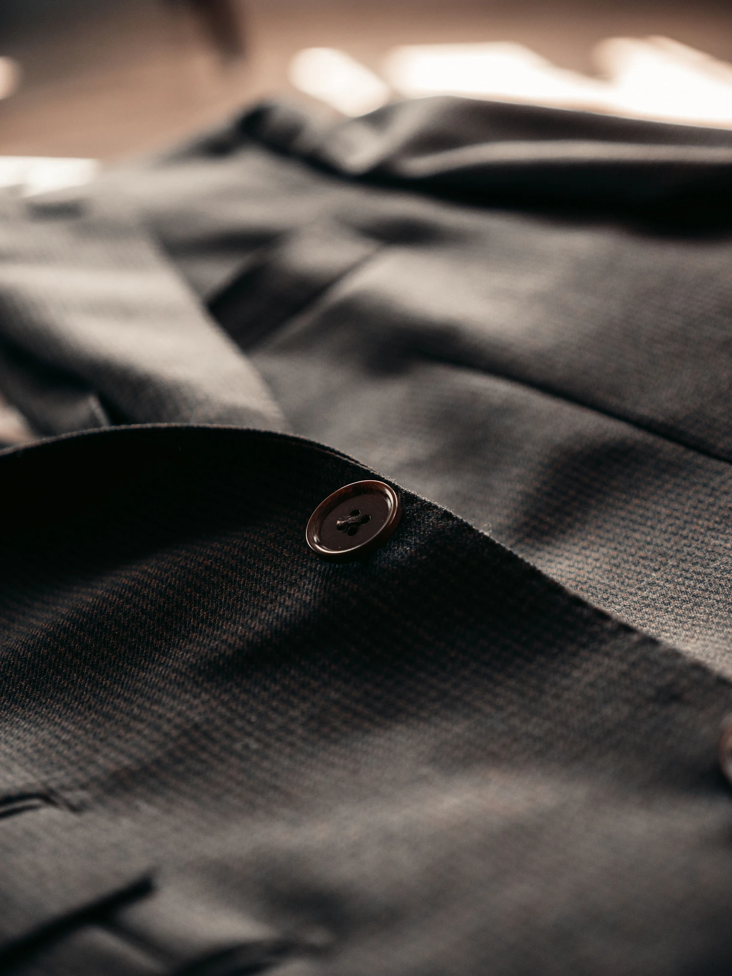 The Shilbottle overshirt folded flat in dark moleskin, the button placket running down the frame