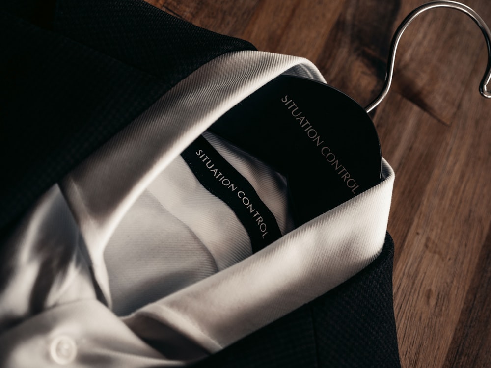 black and white textile on brown wooden table