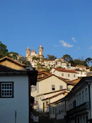 white and brown concrete buildings under blue sky during daytime