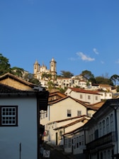 View from hotel balcony showing the rolling hills and colonial rooftops of Ouro Preto.
