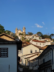 white and brown concrete buildings under blue sky during daytime