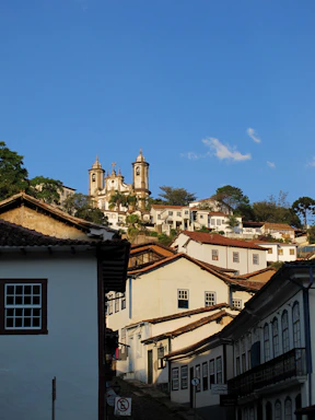 white and brown concrete buildings under blue sky during daytime