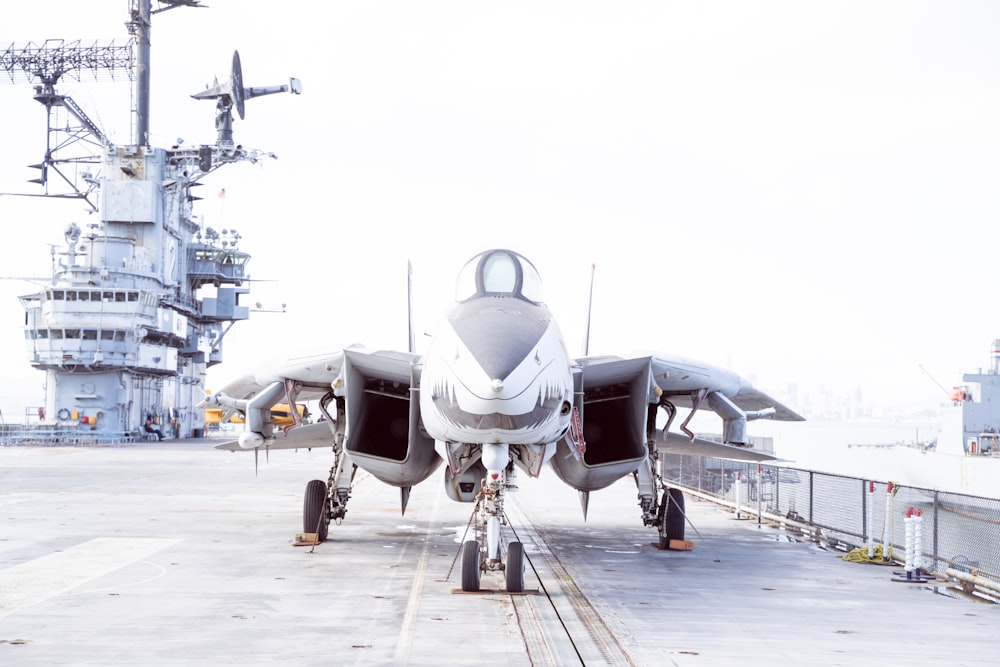 gray fighter plane on airport during daytime