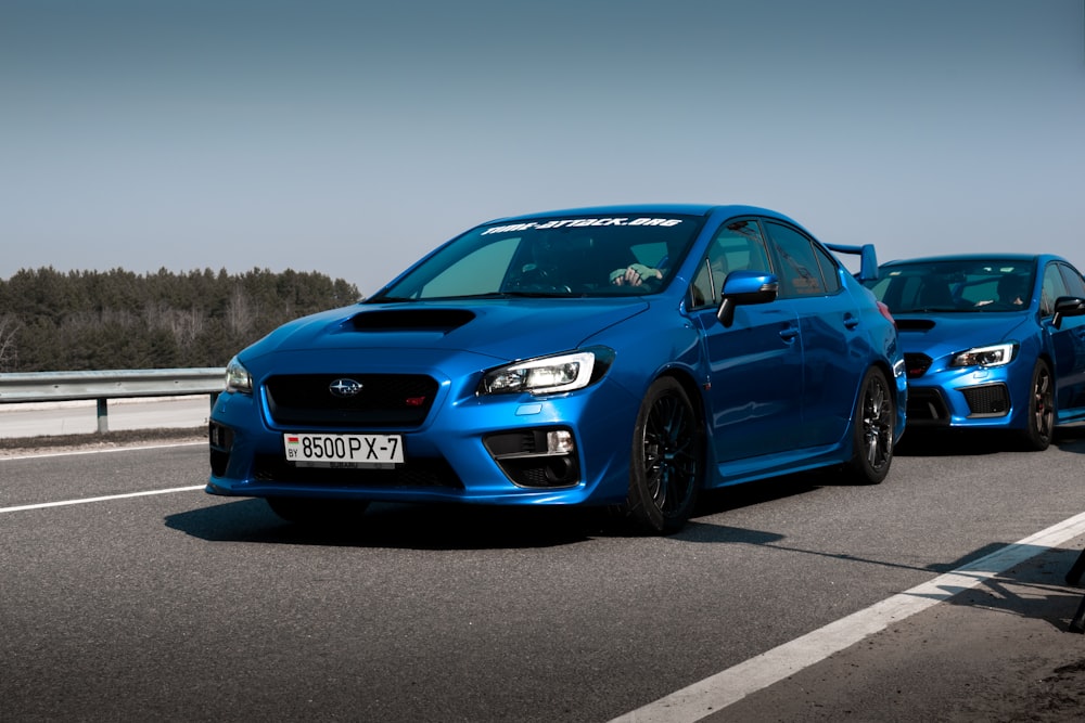 blue subaru on a race track 