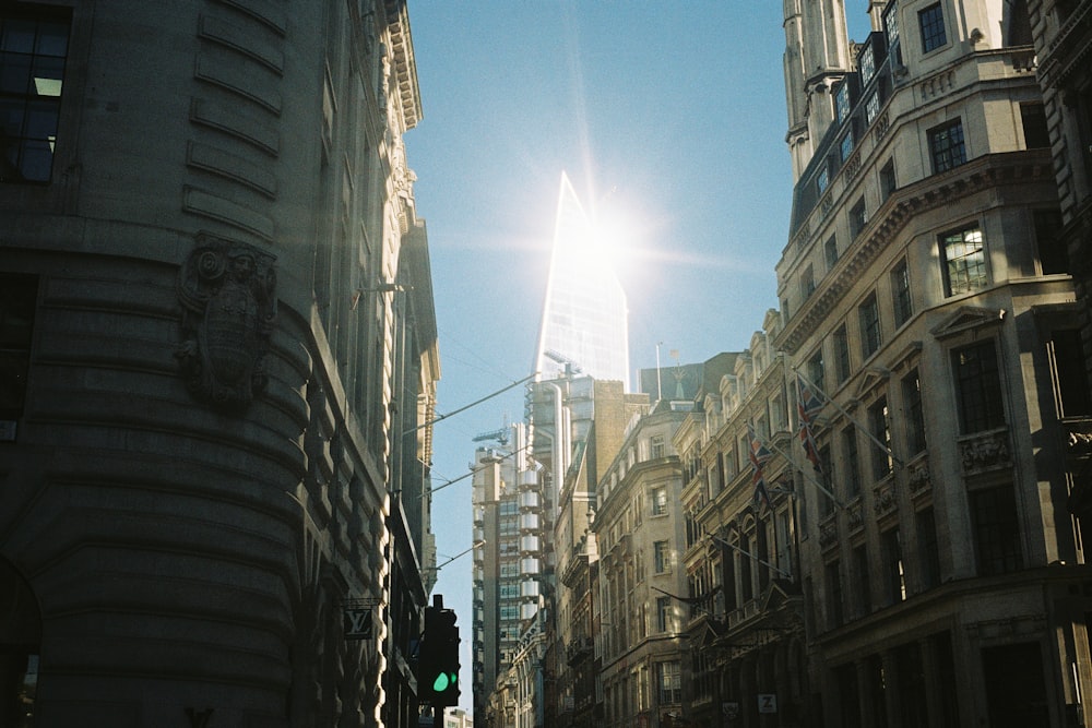 people walking on street between high rise buildings during daytime