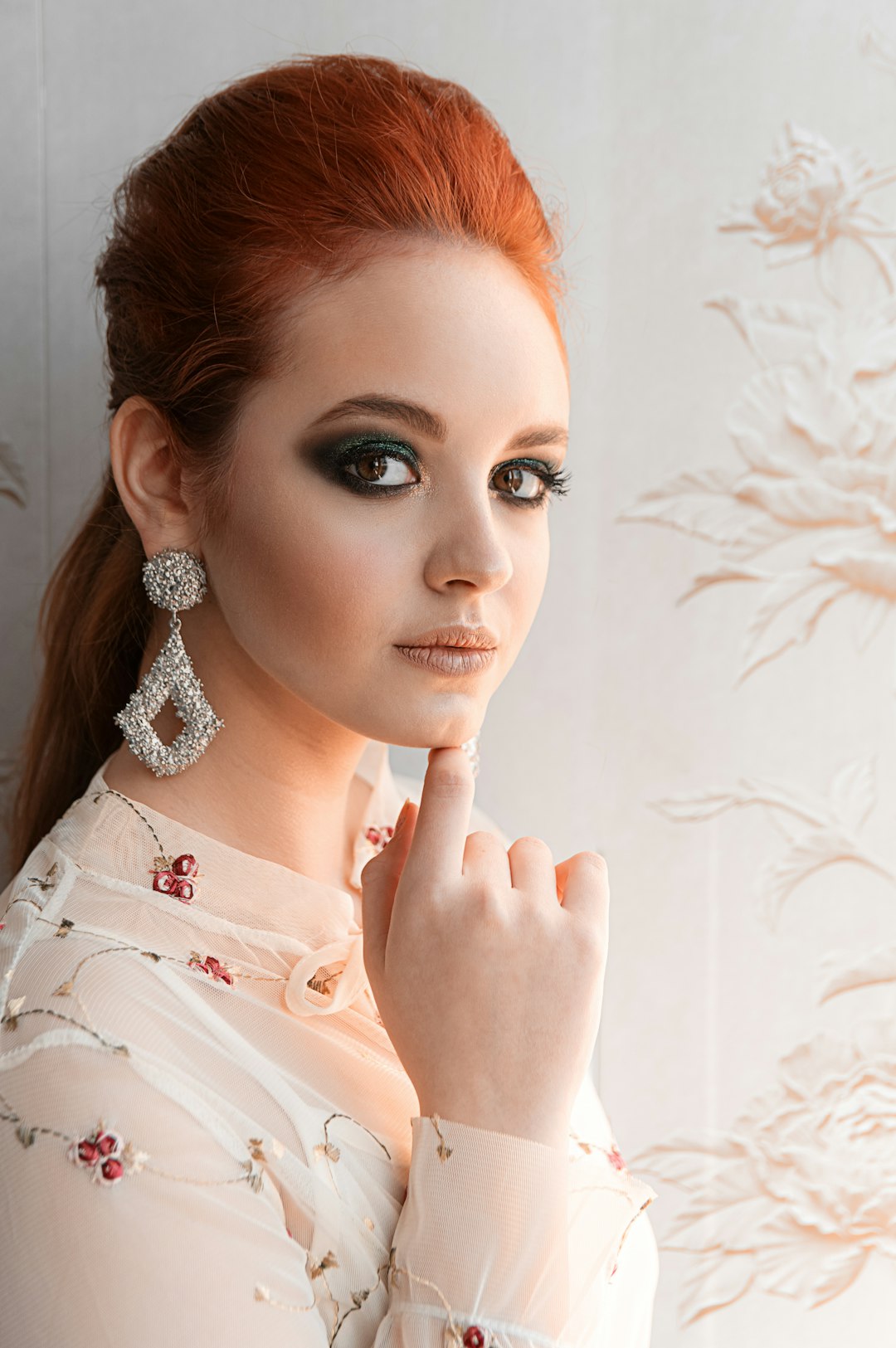 woman in white shirt with silver and diamond studded ring