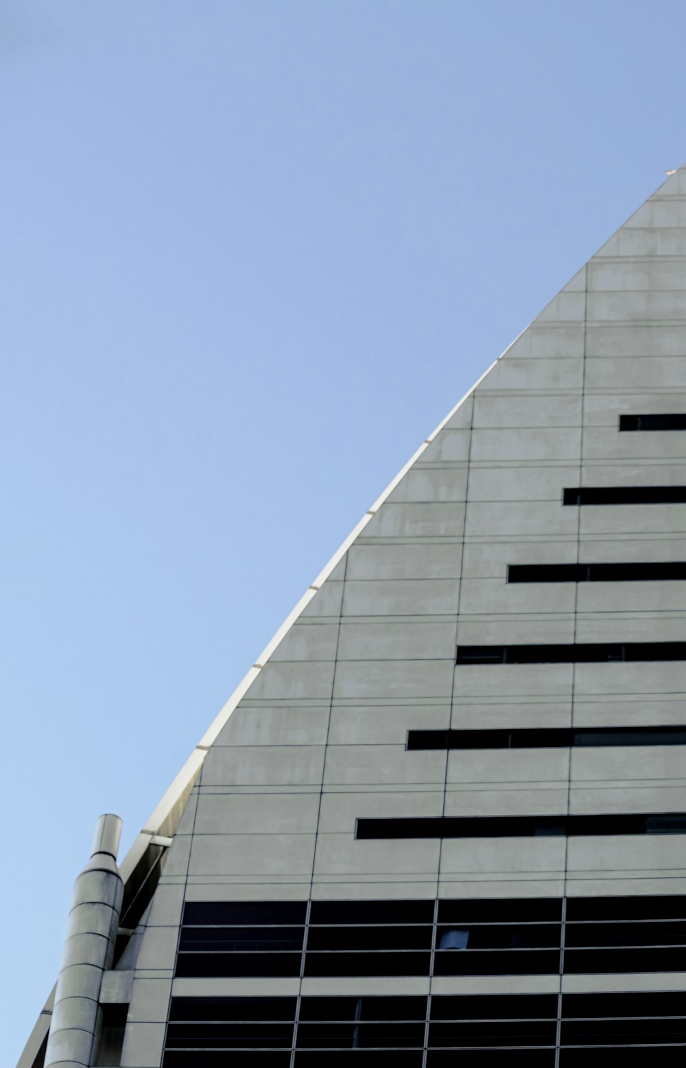 white concrete building under blue sky during daytime