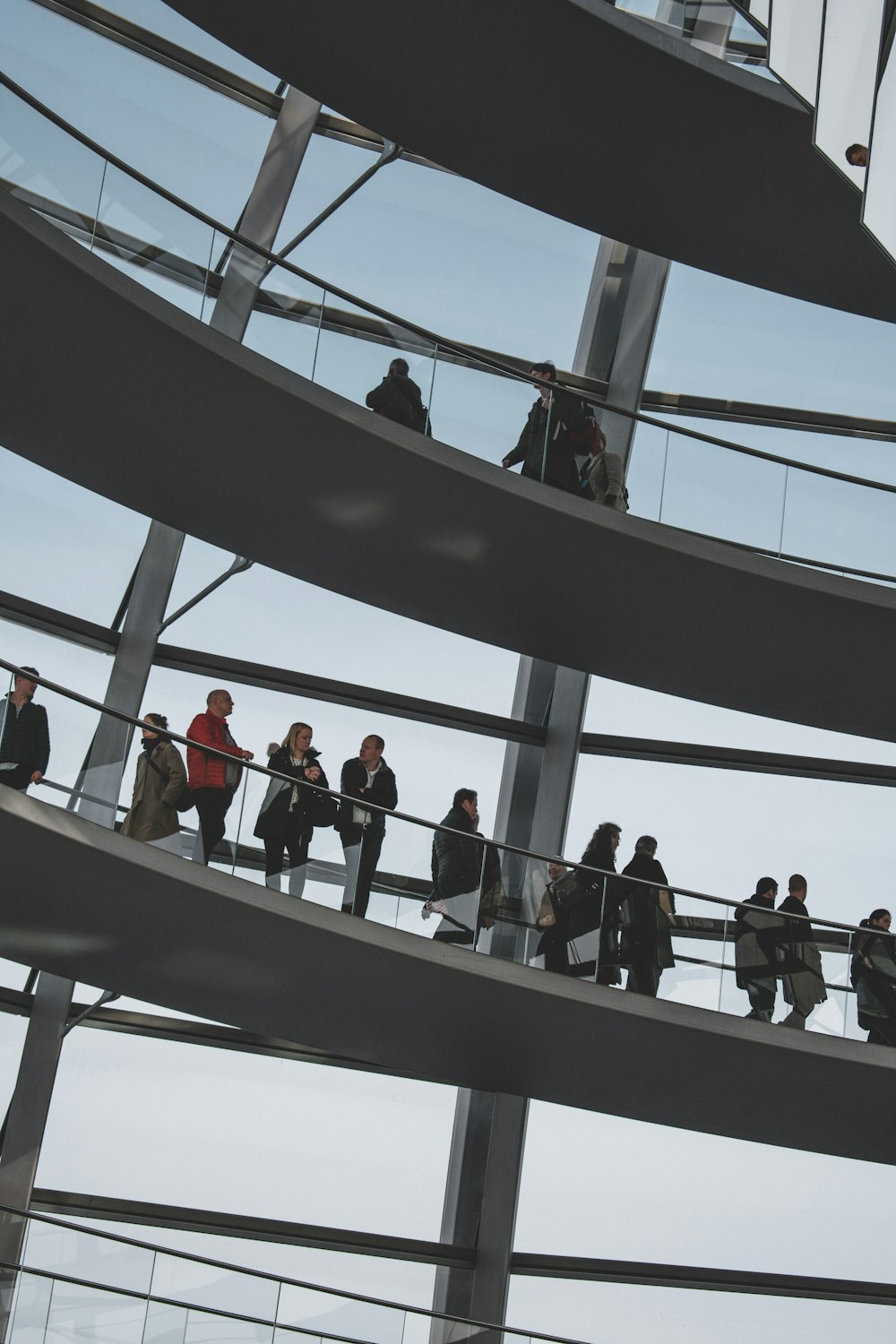 people walking on gray concrete stairs during daytime