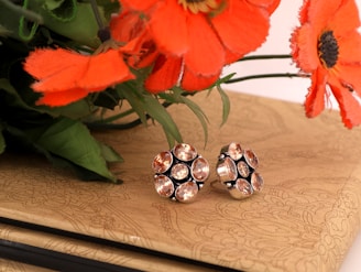 A selection of vibrant gemstone earrings showcased against a light background.